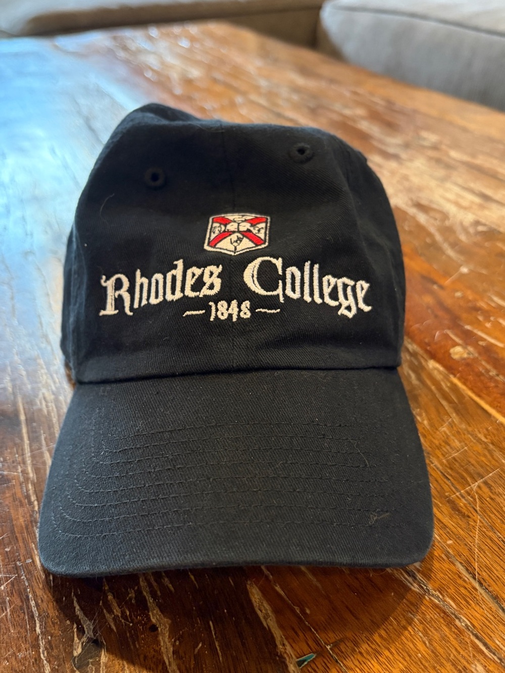 47 Rhodes College Black hat with White Embroidery